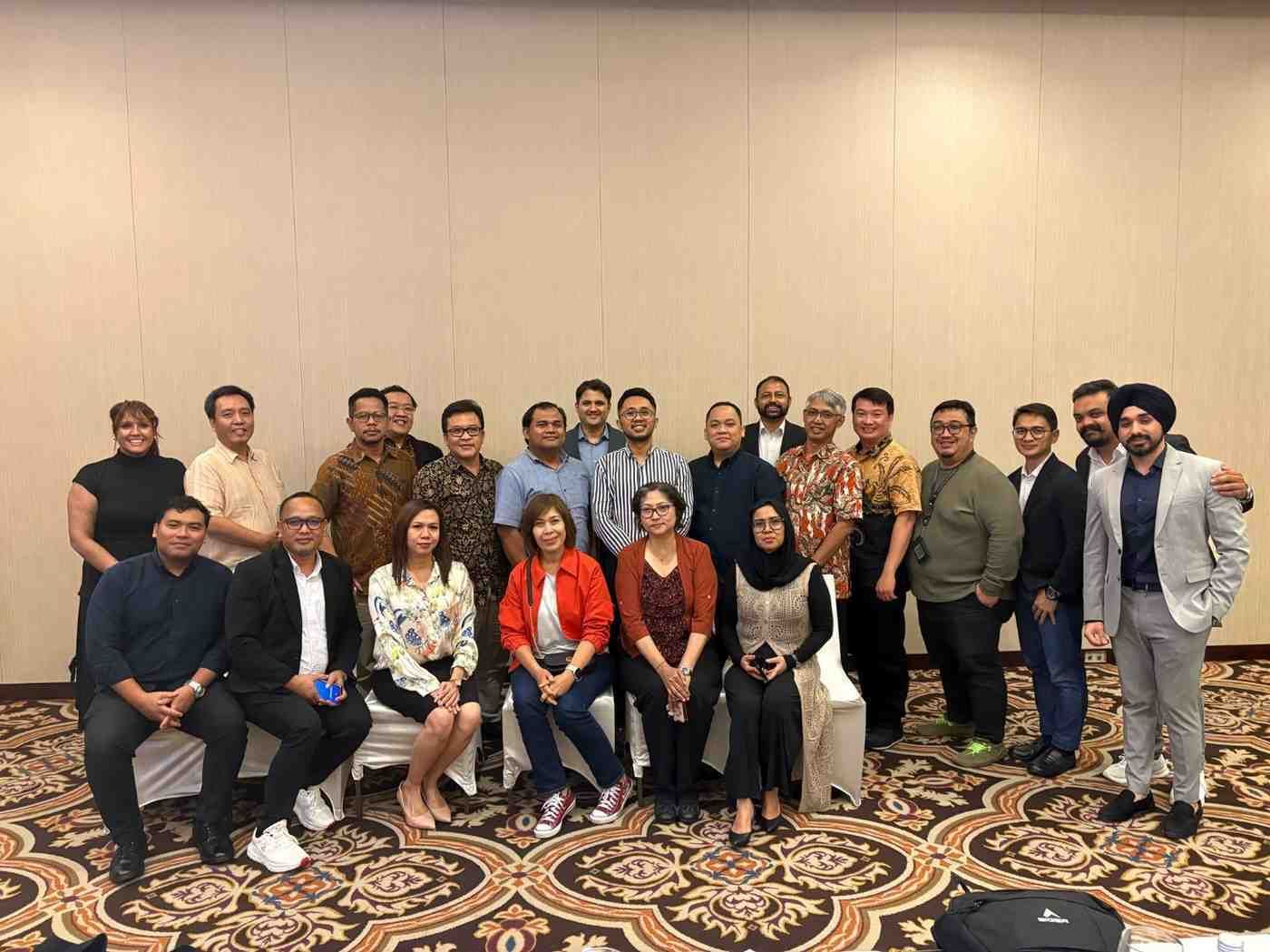 Participants of Neutrinos event posing for a group photo after a session on AI in insurance - Neutrinos