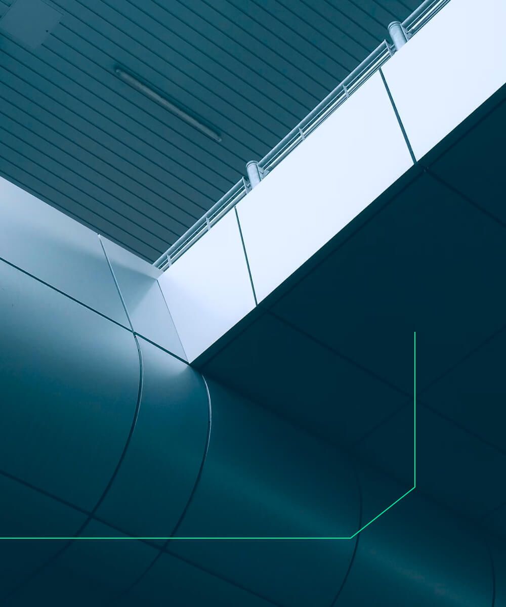 Geometric architectural view of a modern building ceiling with clean lines and teal accent lighting – Neutrinos